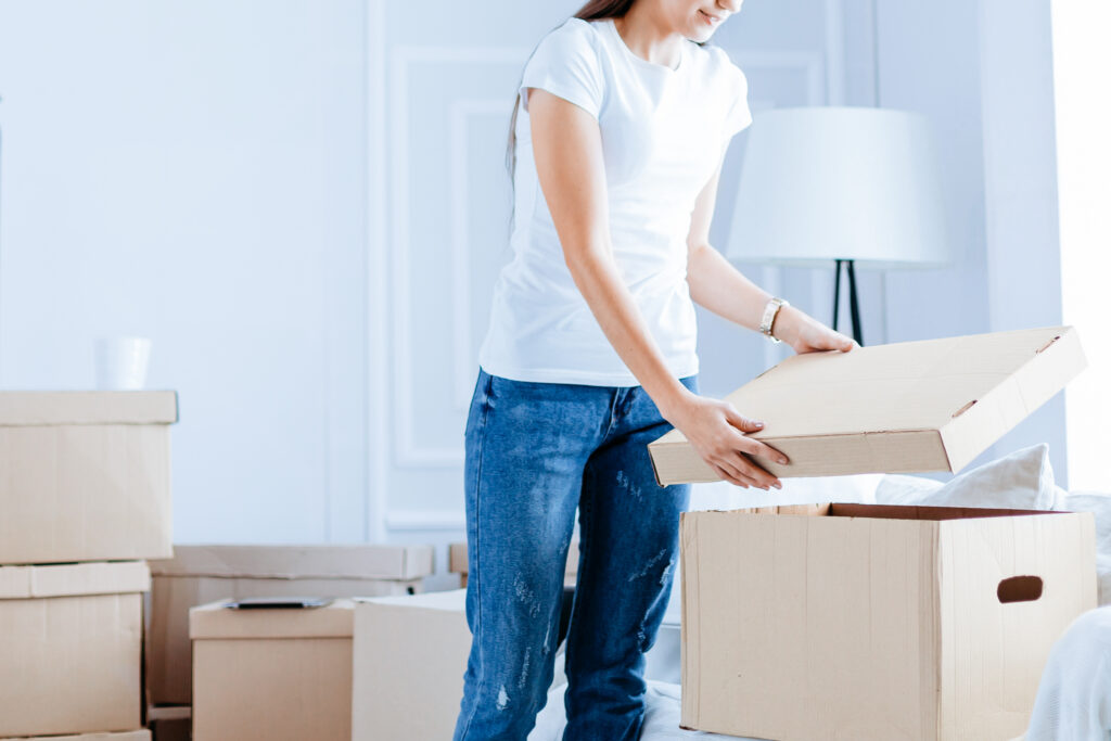 Woman inspecting a box in storage