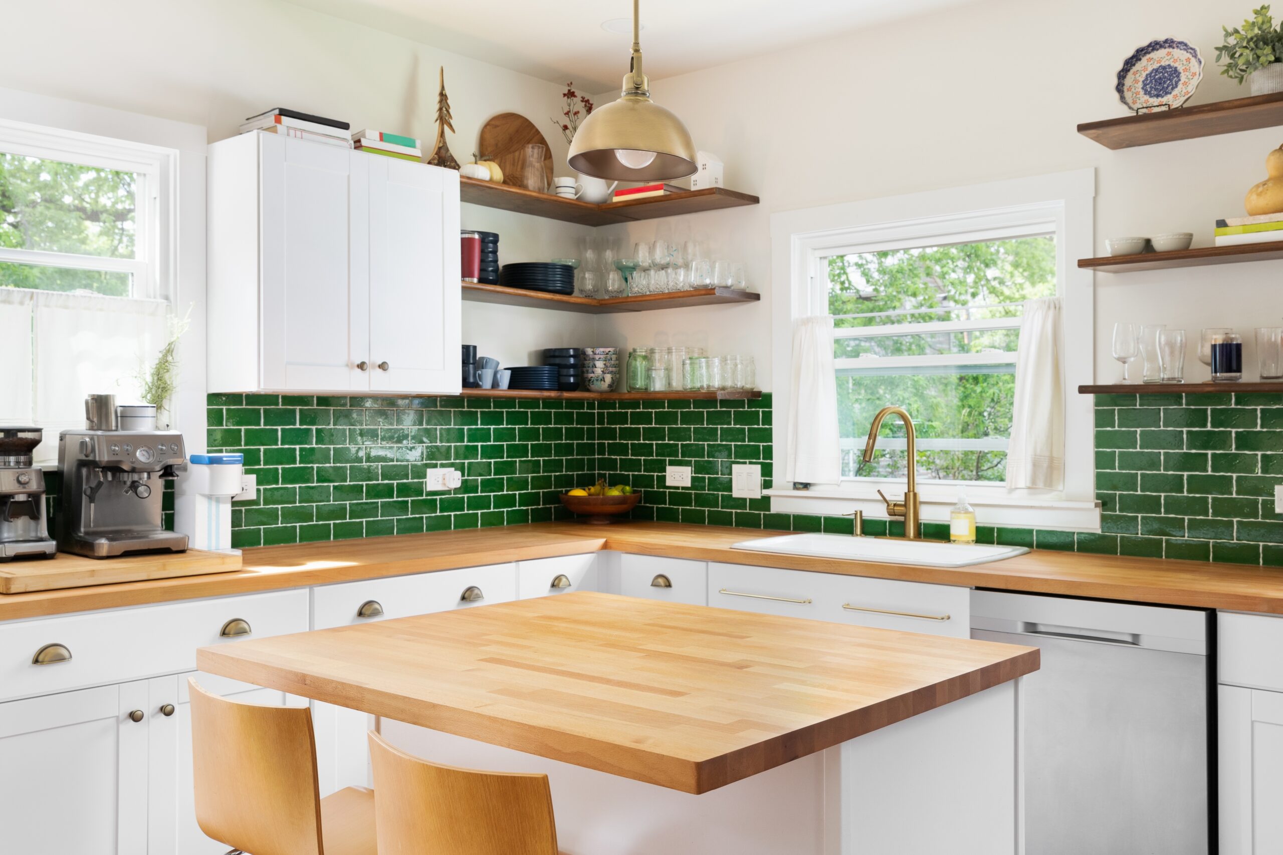 Kitchen with green backsplash