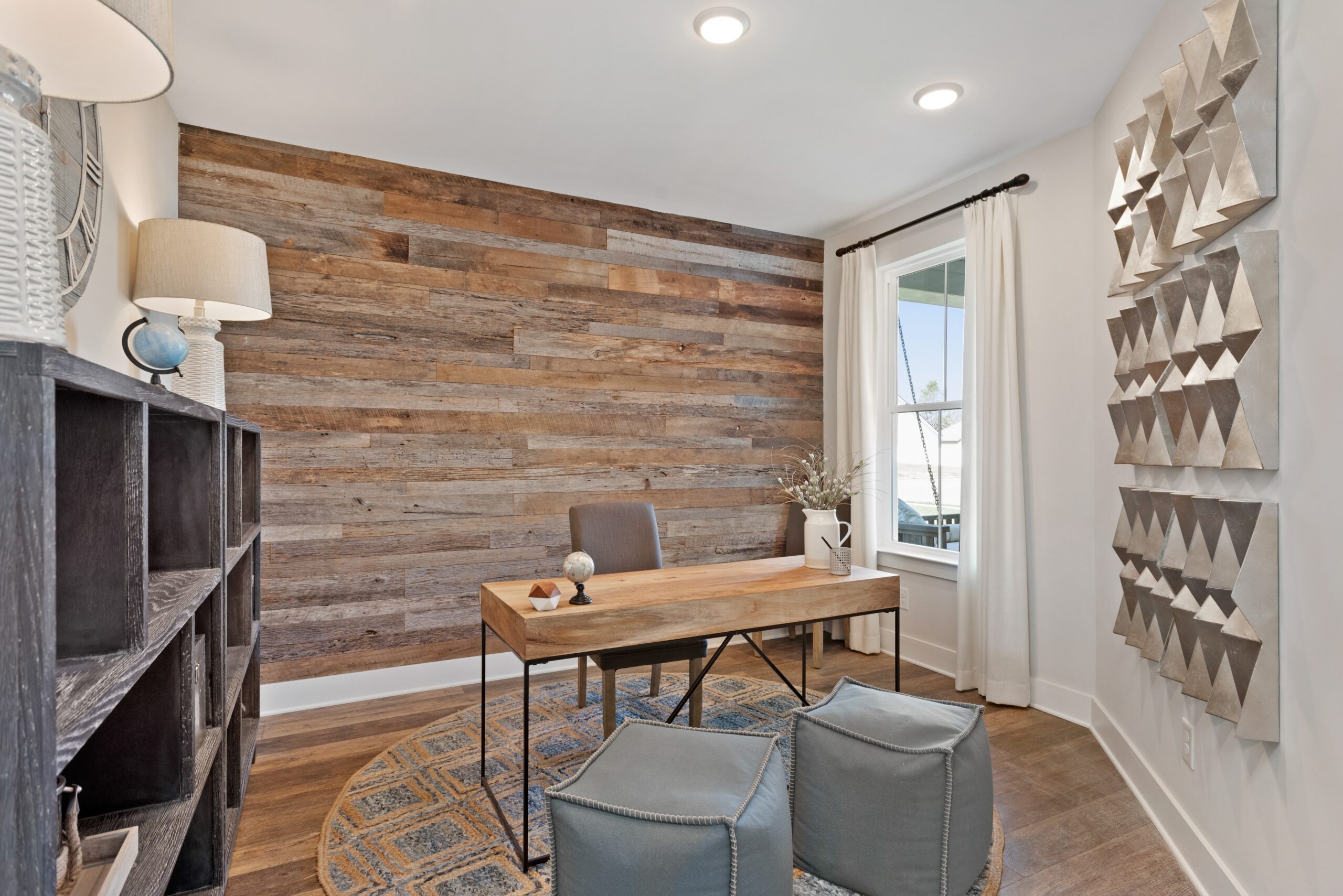a home office with wooden accent wall